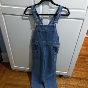 We Wore What light wash denim overalls